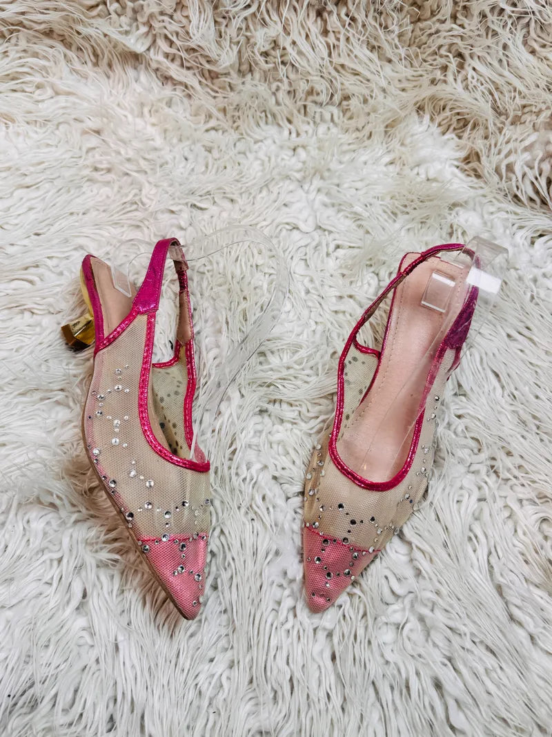 Shocking pink pumps heel