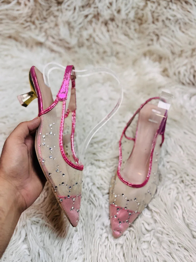 Shocking pink pumps heel